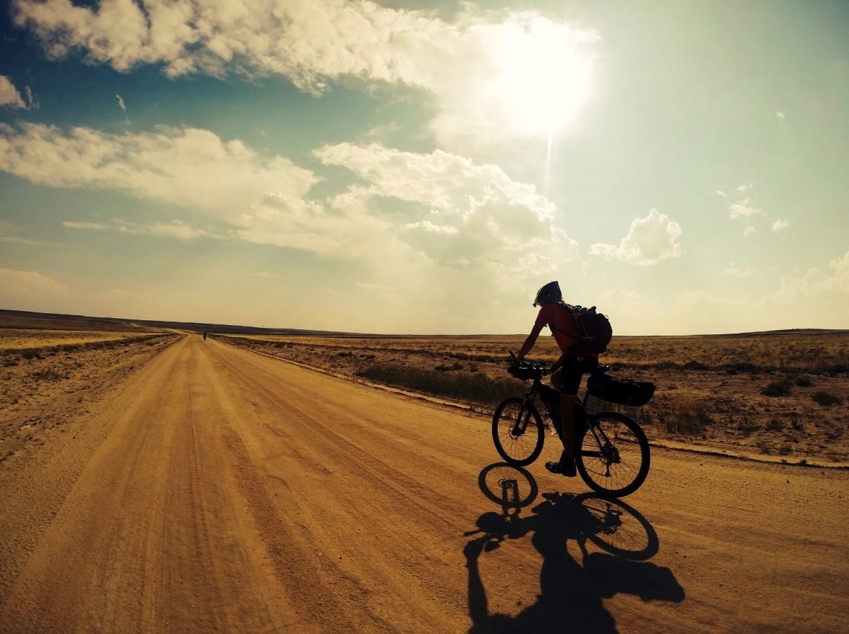 Bikepacking bike setup on trail terrain.